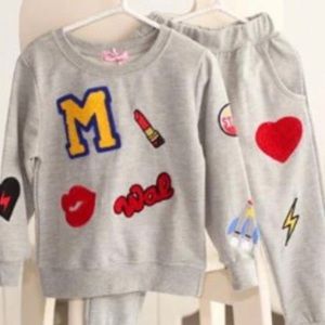 Girls Two-Piece Crème Joggers Set. Size 3T-5T available